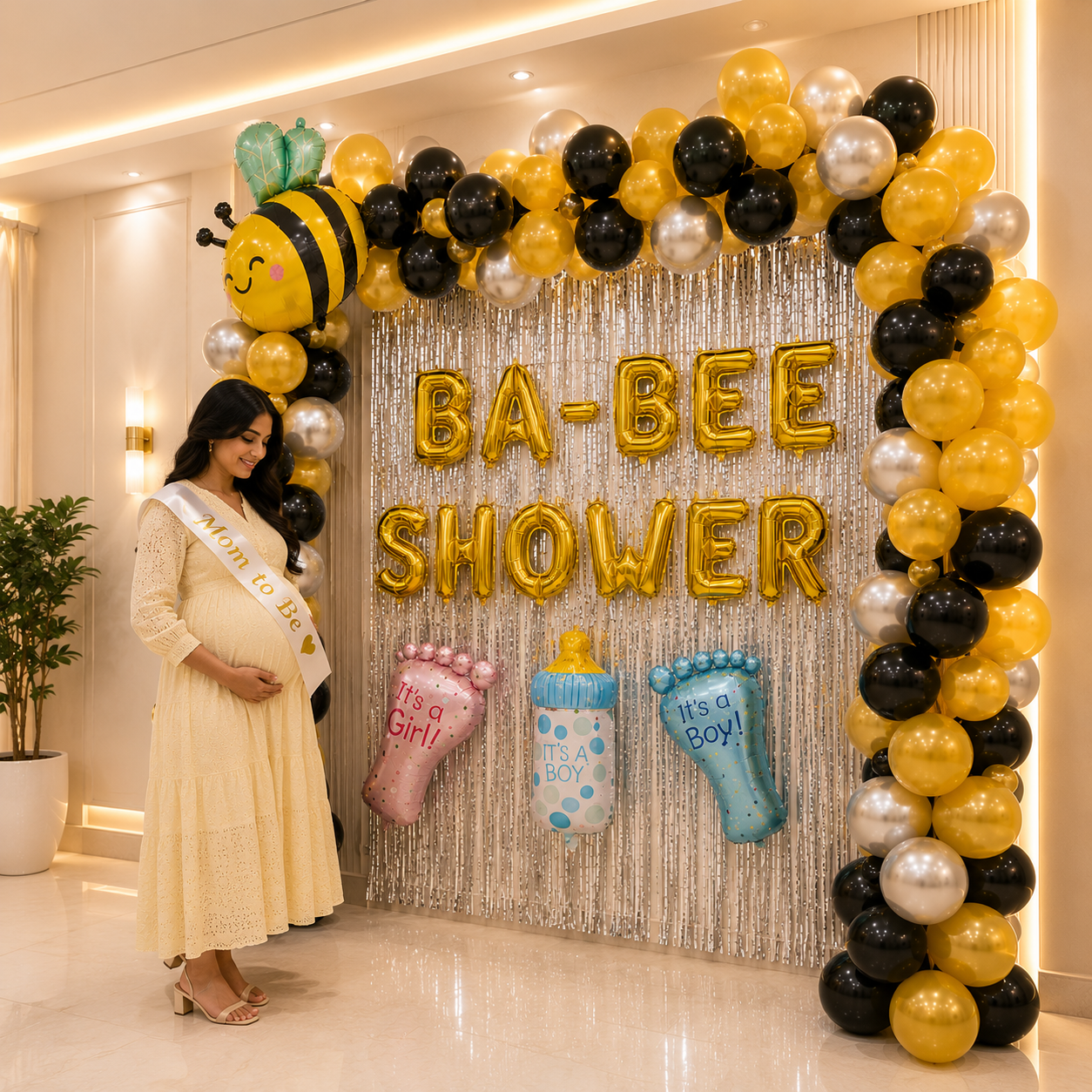 Decorated 'BA-BEE SHOWER' with balloons and a pregnant woman in a yellow dress.