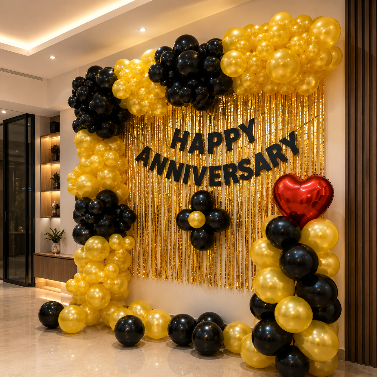 Decorative setup with balloons and 'Happy Anniversary' text in a room.