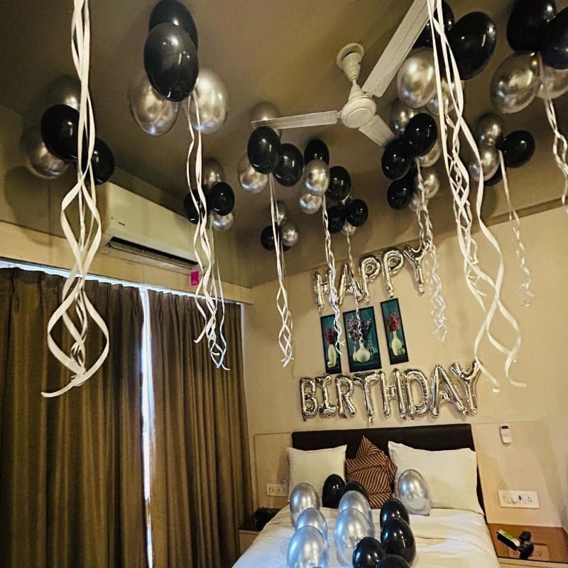 Silver and Black Balloon Decoration in Room for Birthday