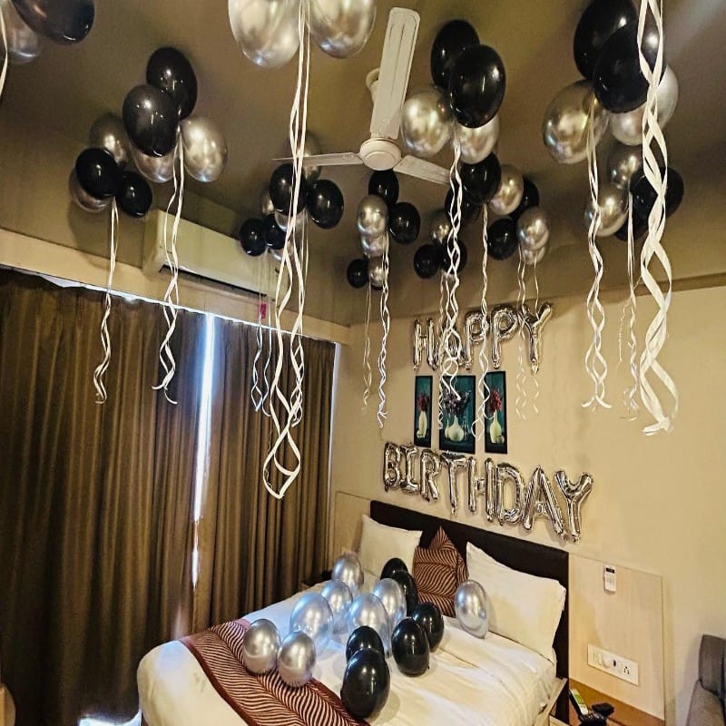 Silver and Black Balloon Decoration in Room for Birthday