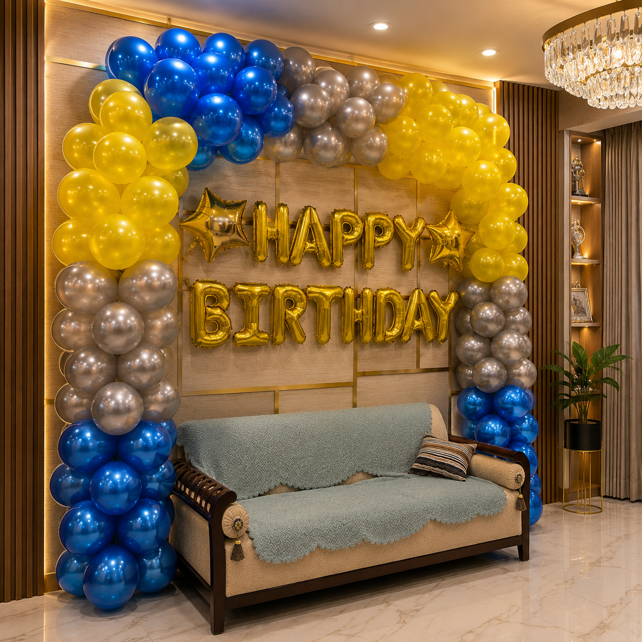 Decorative setup with balloons and 'Happy Birthday' sign in a room.