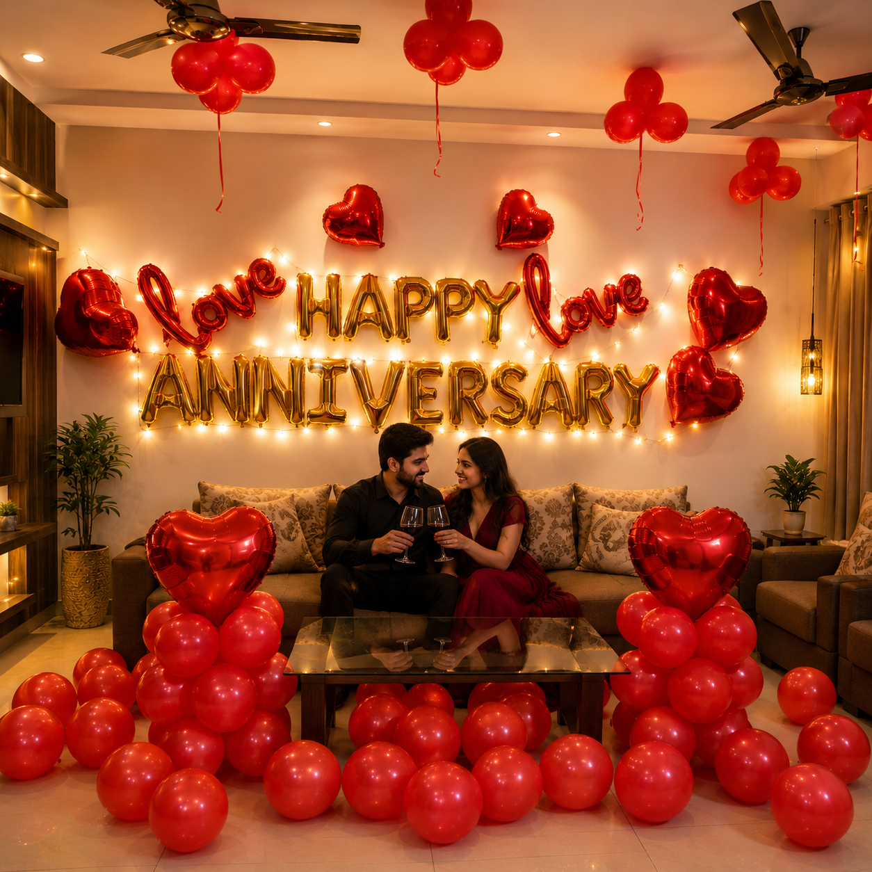Couple celebrating an anniversary with red balloons and 'Happy Anniversary' decorations in a living room.
