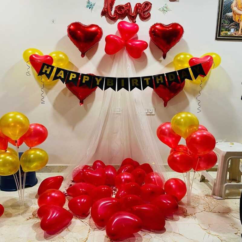 Romantic Cabana setup balloon decoration in living room with fairy light