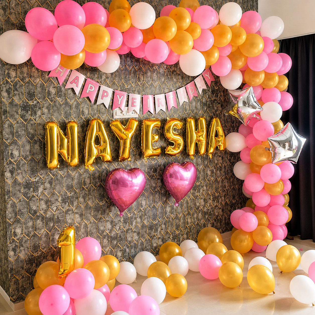 Decorative arch with balloons and 'Happy Birthday Nayesha' banner on a textured wall.