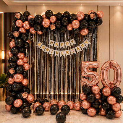 Decorative setup with balloons and 'Happy Anniversary 50' banner for a milestone celebration.
