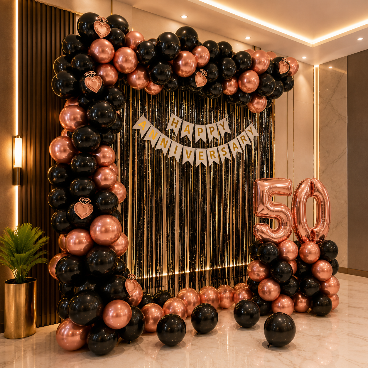 Decorative setup with balloons and 'Happy Anniversary 50' banner in a room.