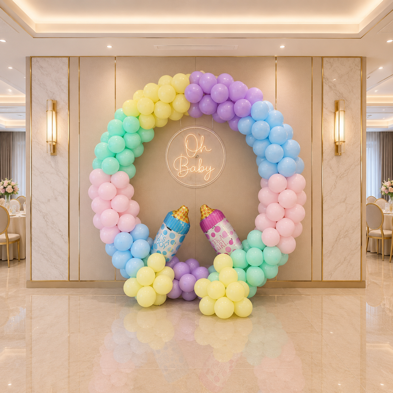 Colorful balloon arch with baby shower decorations in a elegant room.