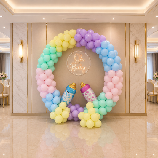 Colorful balloon arch with baby shower decorations in a elegant room.