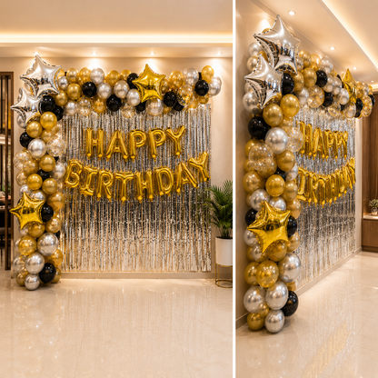 Birthday balloon arch with 'Happy Birthday' balloons in a decorated hallway.