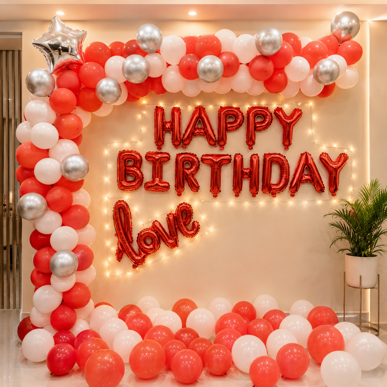 Birthday decoration with red, white, and silver balloons and 'Happy Birthday Love' text.