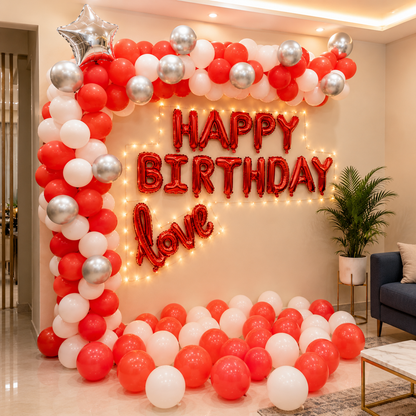 Birthday balloon arch with 'Happy Birthday Love' text in a room setting.