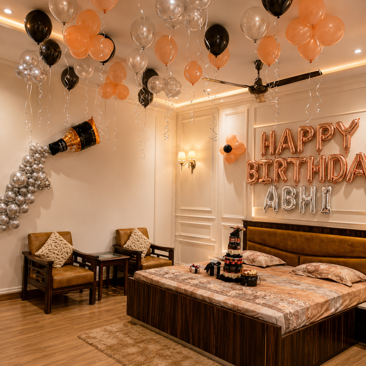 Decorated bedroom with rose gold balloons, a cake, and 'Happy Birthday Abhi' sign.