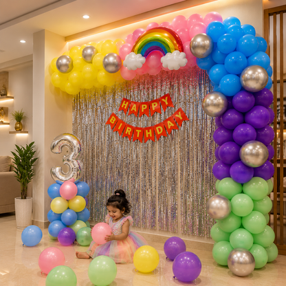 Child in a colorful birthday party setup with balloons and decorations.