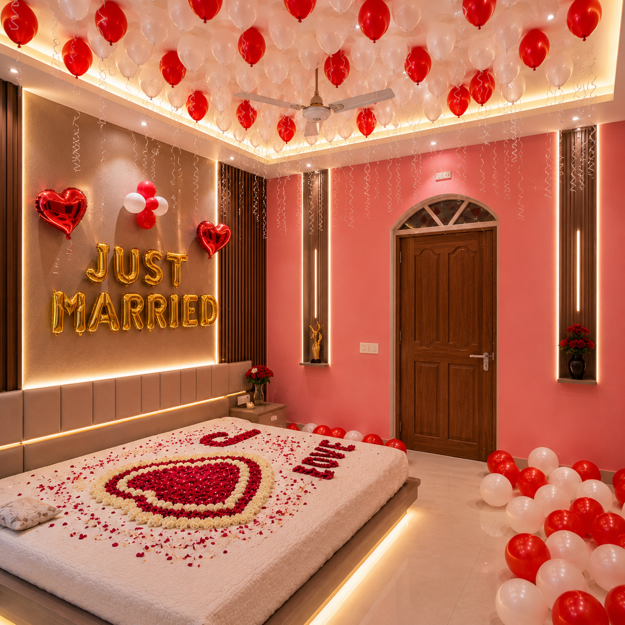 Decorated bedroom with 'Just Married' sign, balloons, and heart decorations.