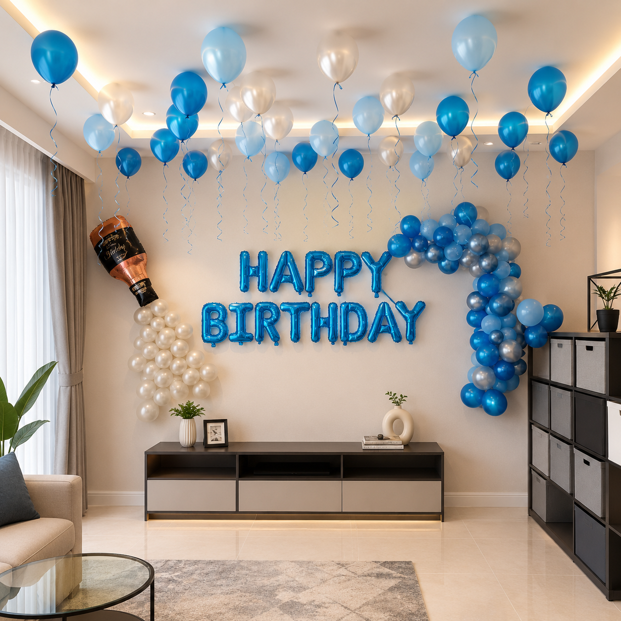 Living room decorated with blue and silver balloons and 'Happy Birthday' sign.