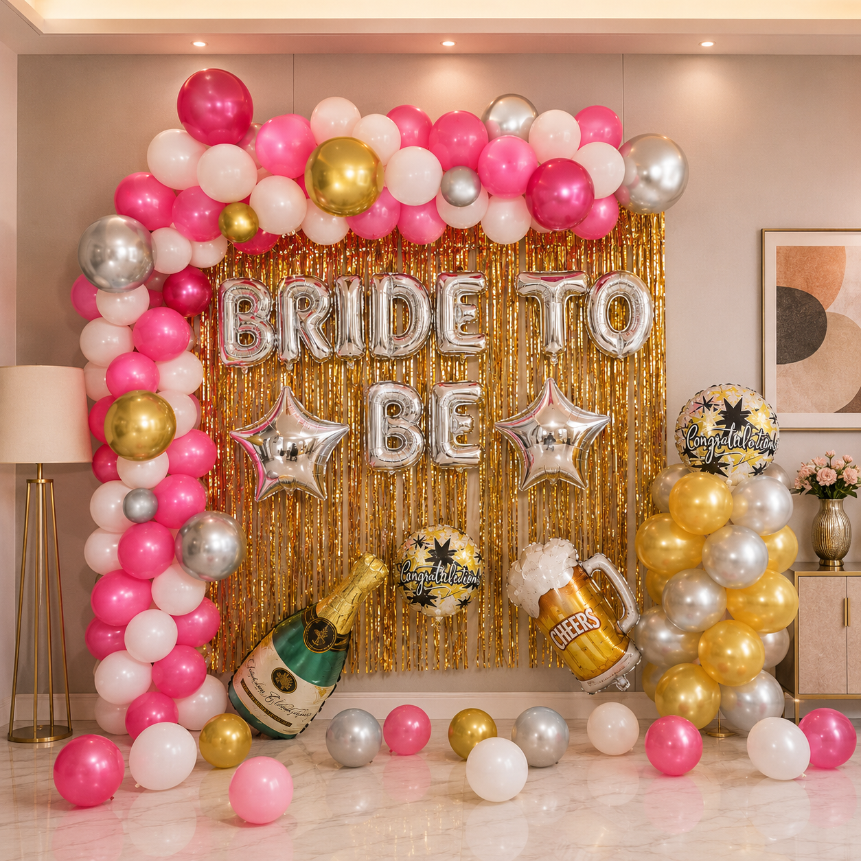 Decorative setup with balloons, 'Bride to Be' sign, and champagne bottle for a bridal shower.