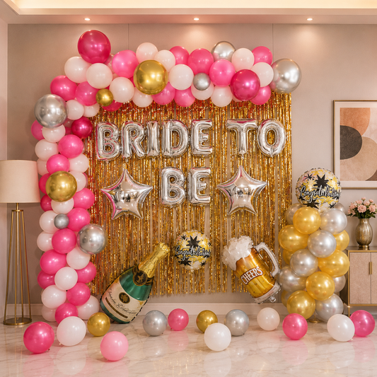 Decorative setup with balloons, 'Bride to Be' sign, and champagne bottle for a bridal shower.