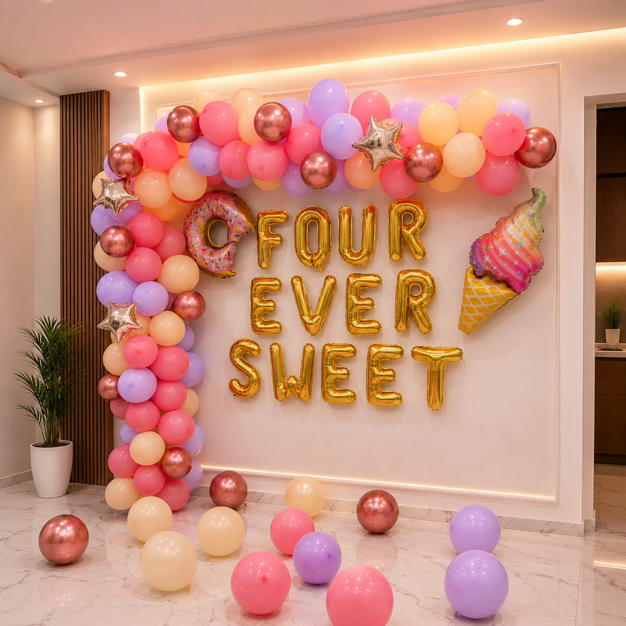 Decorative balloon arch with 'FOUR EVER SWEET' text in a room setting.