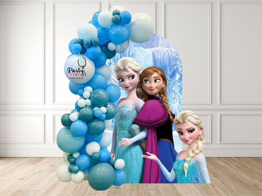 Balloon arch with Frozen-themed cutouts against a white paneled wall.