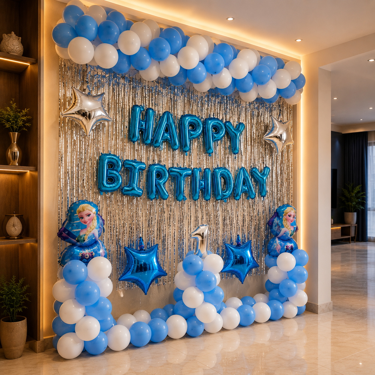 Birthday celebration setup with blue and white balloons, 'Happy Birthday' sign, and Elsa dolls.