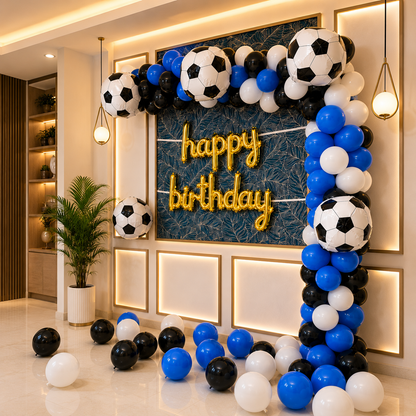 Decorative arch made of soccer ball balloons with 'happy birthday' sign in a room.