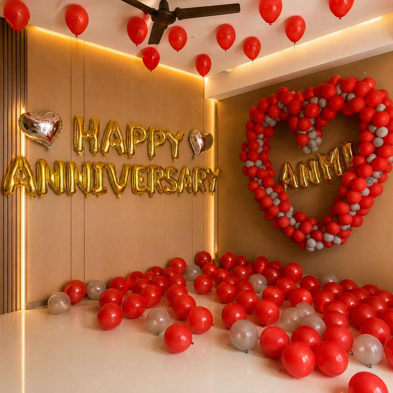 Decorative setup with 'Happy Anniversary' balloons and a heart-shaped balloon arrangement on a wall.