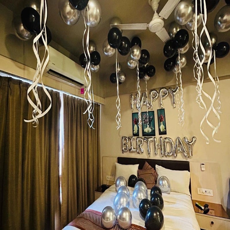 Silver and Black Balloon Decoration in Room for Birthday