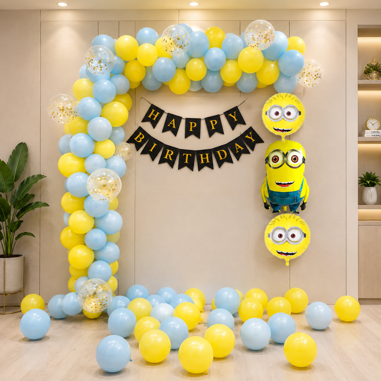 Birthday balloon arch with Minion balloons and 'Happy Birthday' banner in a room.