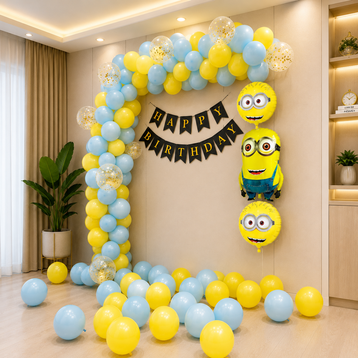 Birthday balloon arch with yellow and blue balloons and Minion-themed decorations.