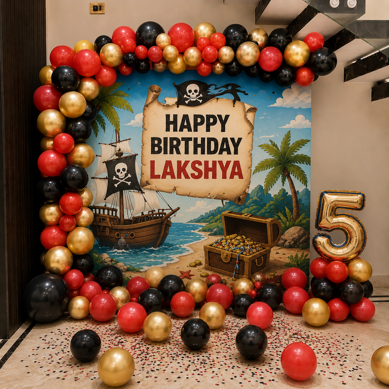 Birthday party setup with pirate-themed decorations, balloons, and a 'Happy Birthday Lakshya' sign.