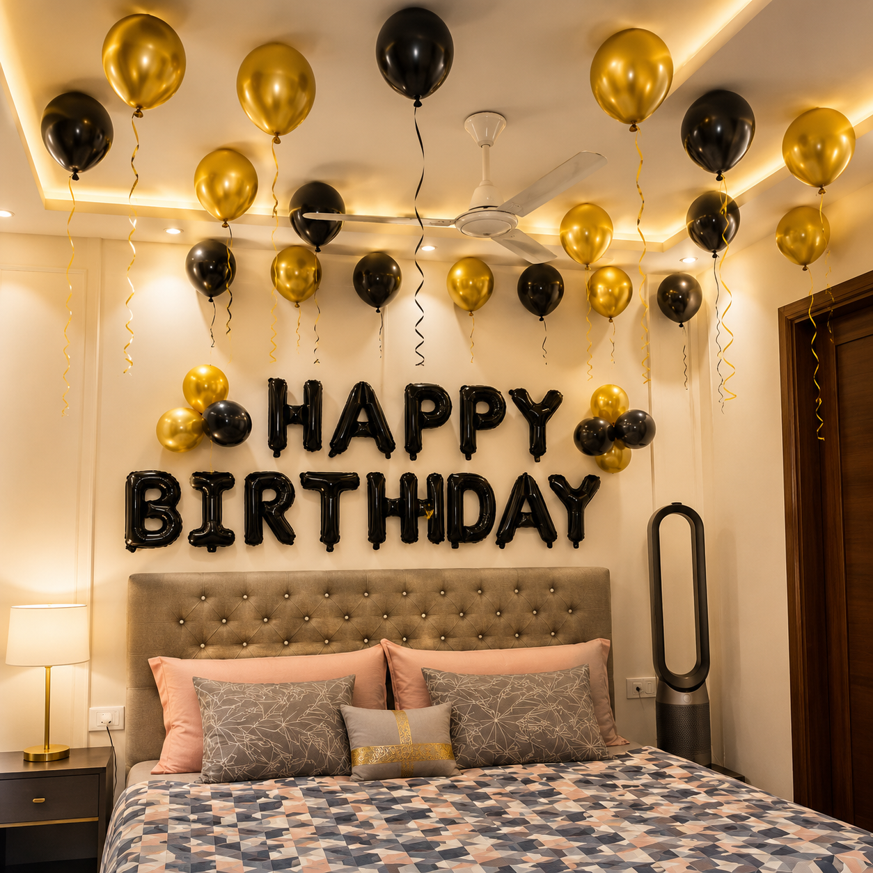 Decorated bedroom with 'Happy Birthday' balloons and letters above a bed.