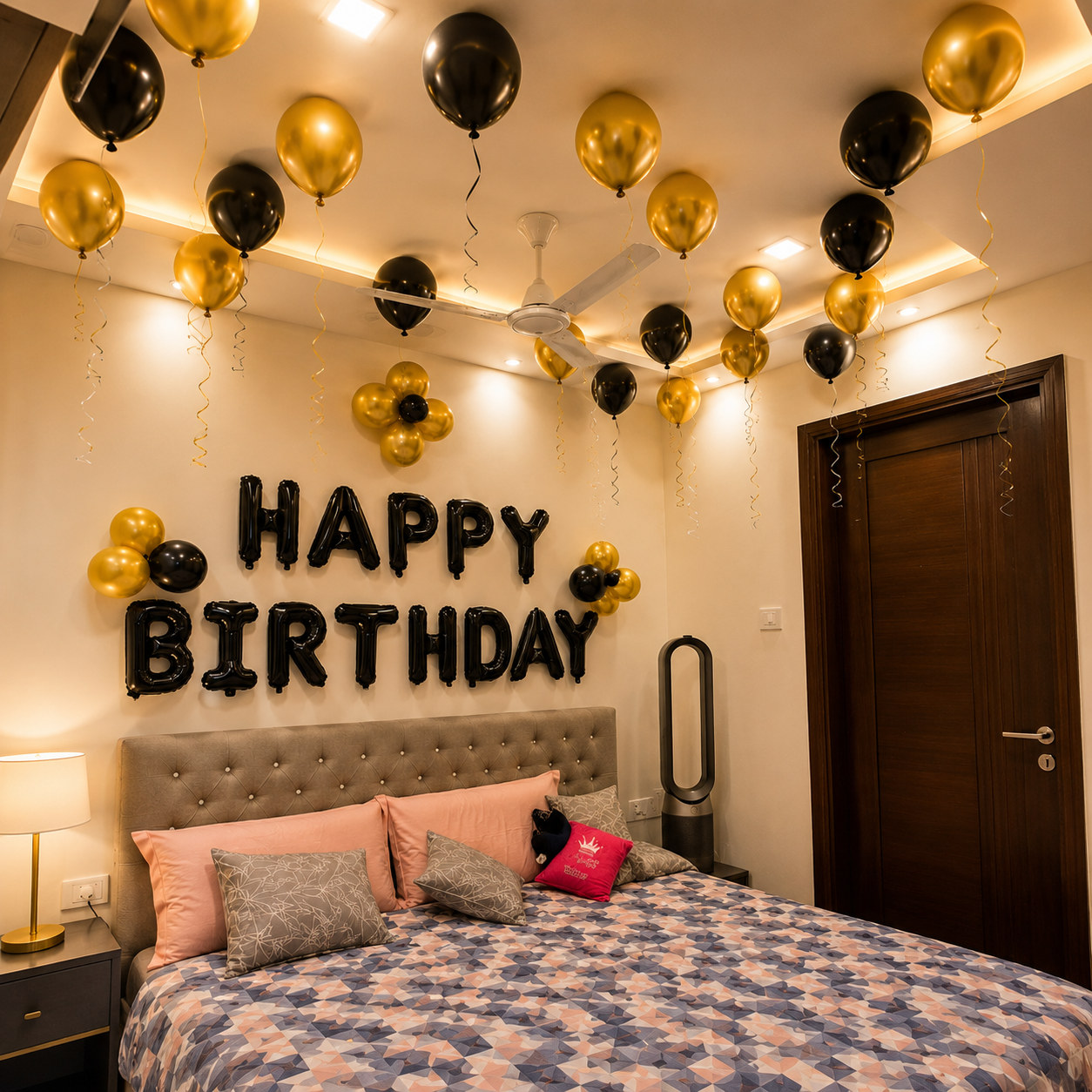 Bedroom decorated with 'Happy Birthday' balloons and text on the wall.