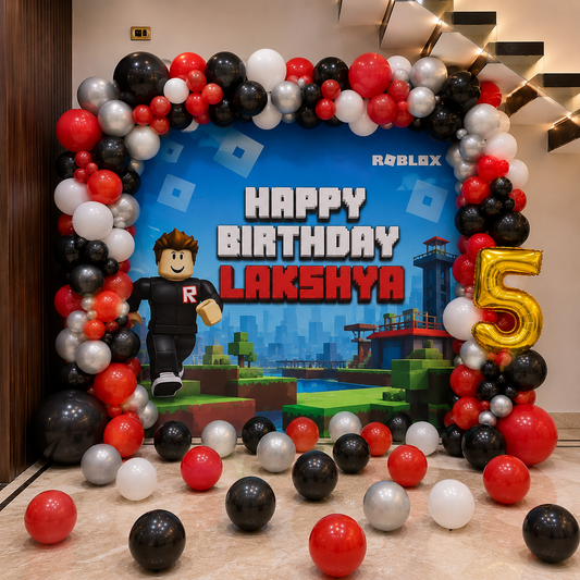 Birthday celebration setup with Roblox-themed backdrop and balloons