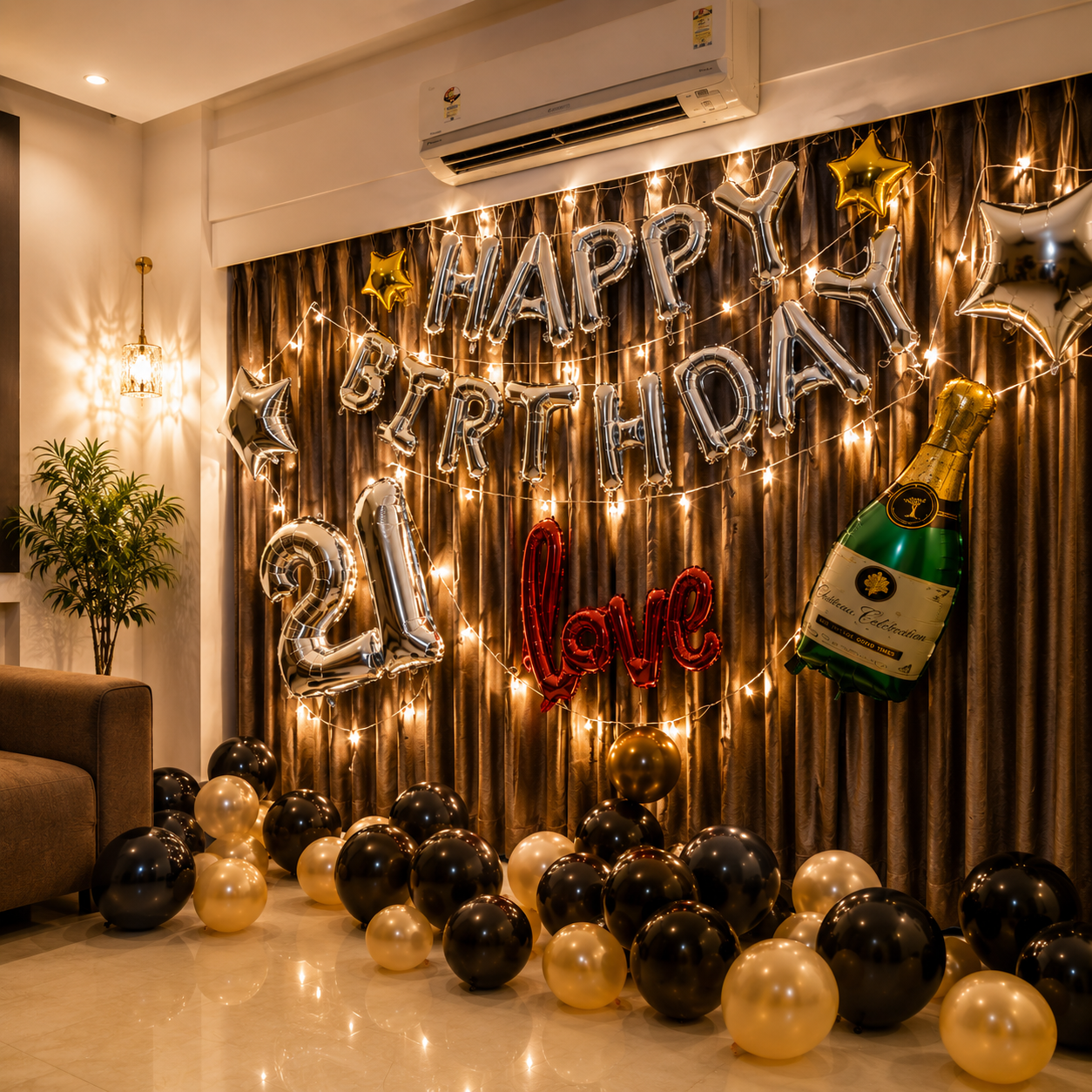 Birthday celebration setup with balloons, a bottle of champagne, and decorative lights.