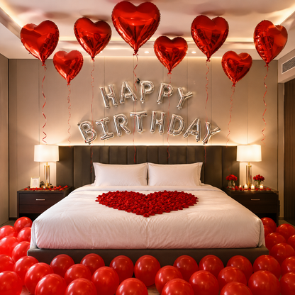 Decorated bedroom with red balloons, heart-shaped decorations, and 'Happy Birthday' balloons.
