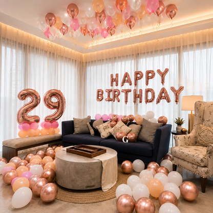 Birthday room decoration with balloons, 'Happy Birthday' and number '29' balloons, and a couch.