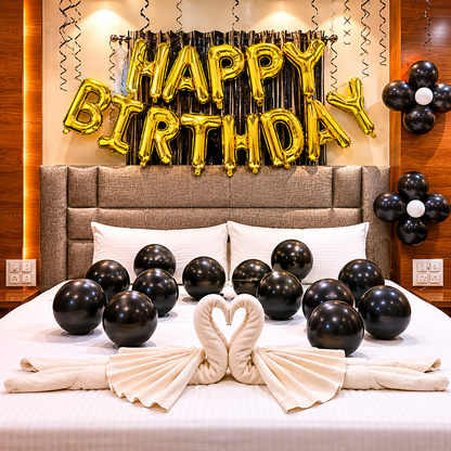 Black balloons on bed