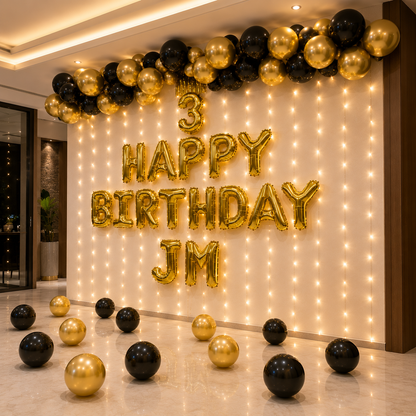 Decorative setup with balloons and lights for a birthday celebration, featuring '3 Happy Birthday JM' text.