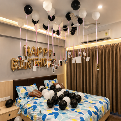 Decorated bedroom with balloons and 'Happy Birthday' sign