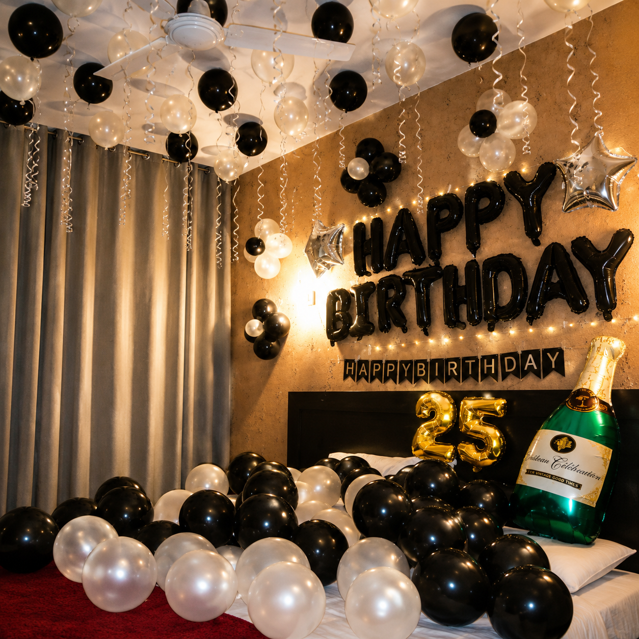 Birthday celebration setup with balloons, 'Happy Birthday' sign, and champagne bottle.