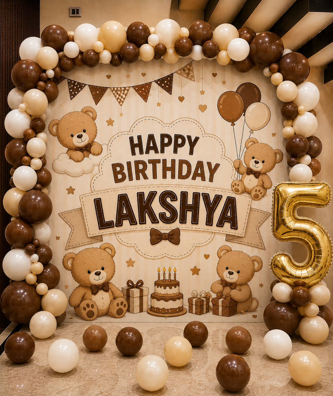 Birthday celebration setup with teddy bears, balloons, and a cake for Lakshya.