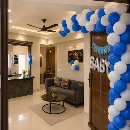 Decorated living room with blue and white balloons and 'Baby' balloons, indicating a baby shower.