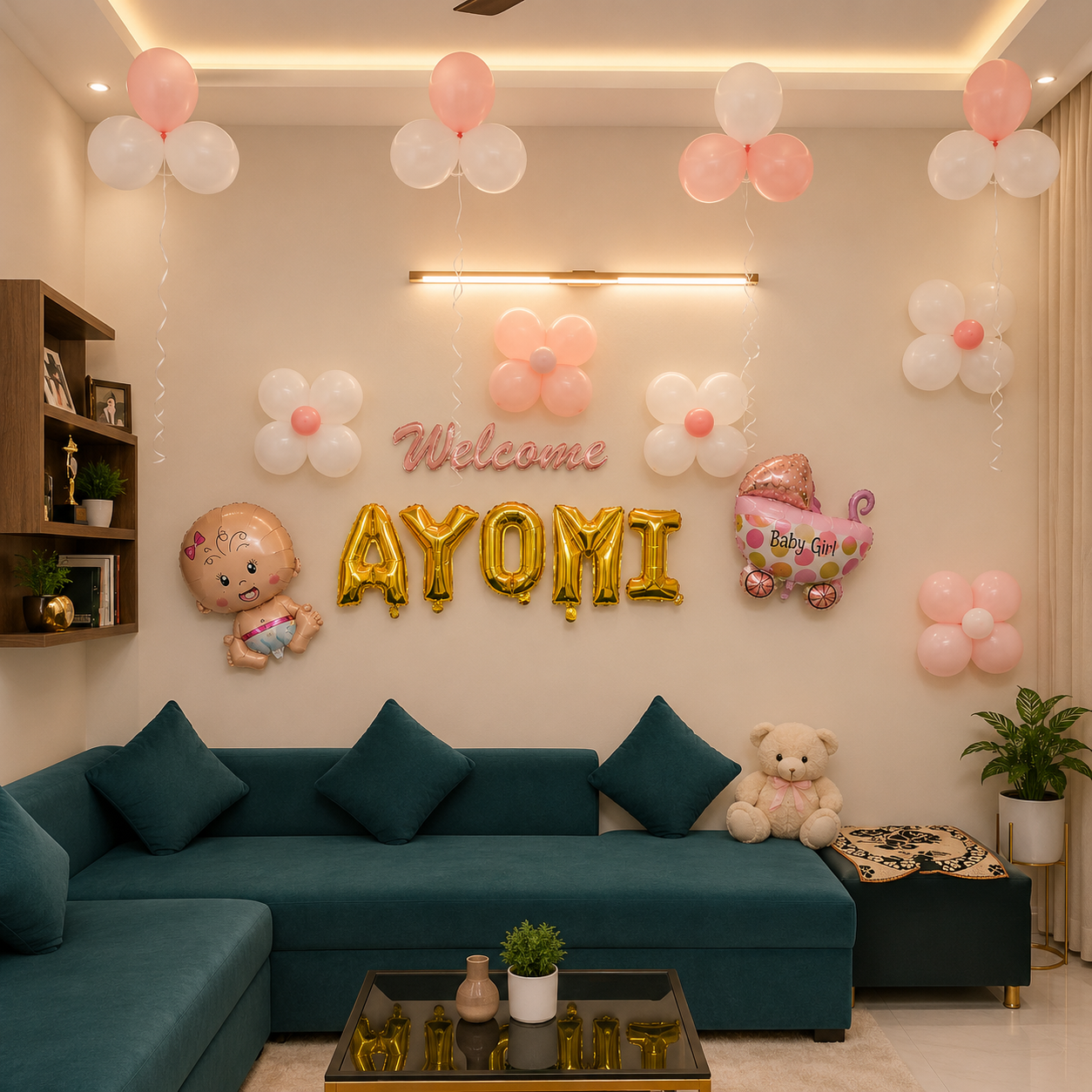 Decorated living room with balloons and 'Welcome Ayomi' sign, featuring a teal sofa and baby-themed decorations.