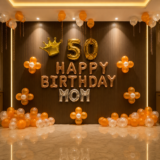 Decorative setup with '50 Happy Birthday Mom' balloons on a brown wall.