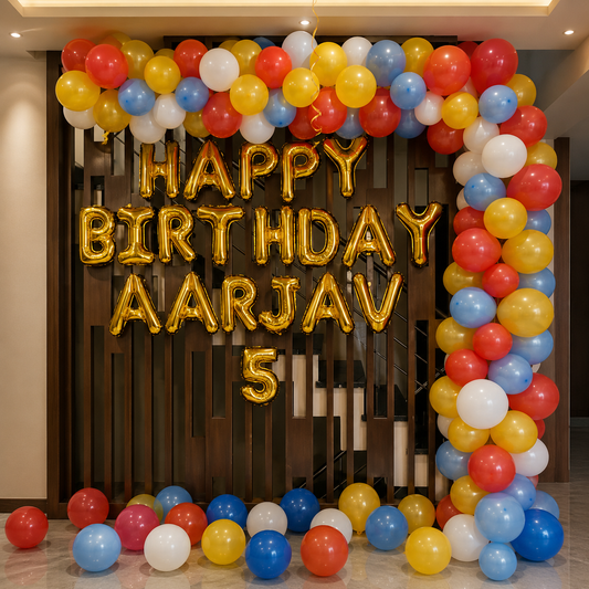 Colorful balloon arch with 'Happy Birthday Aarjav 5' text in a decorated indoor setting.