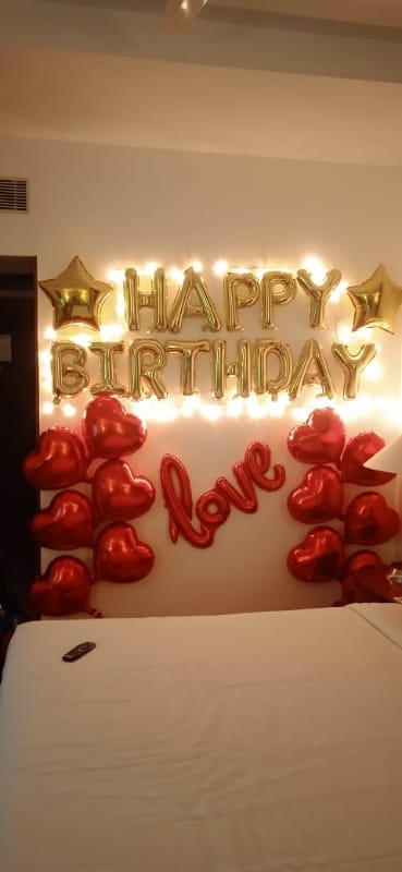 Romantic Surprise for her with Heart Shape Foil Balloons on her birthday with Fairy lights.